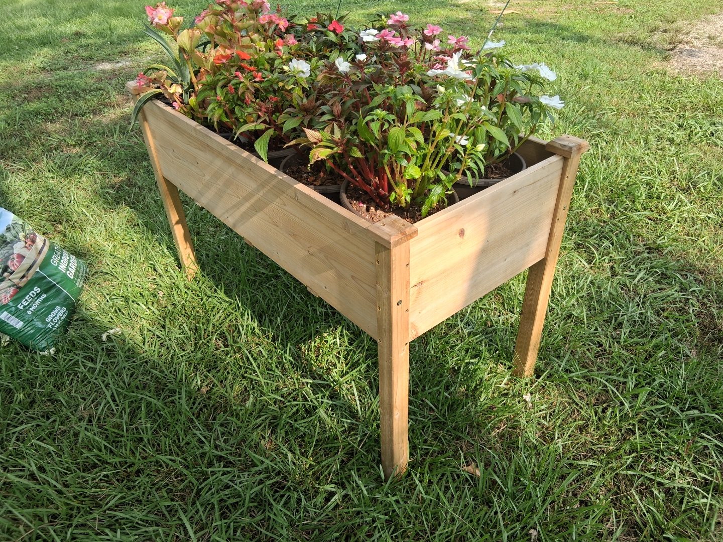 Custom raised planter box with flowers