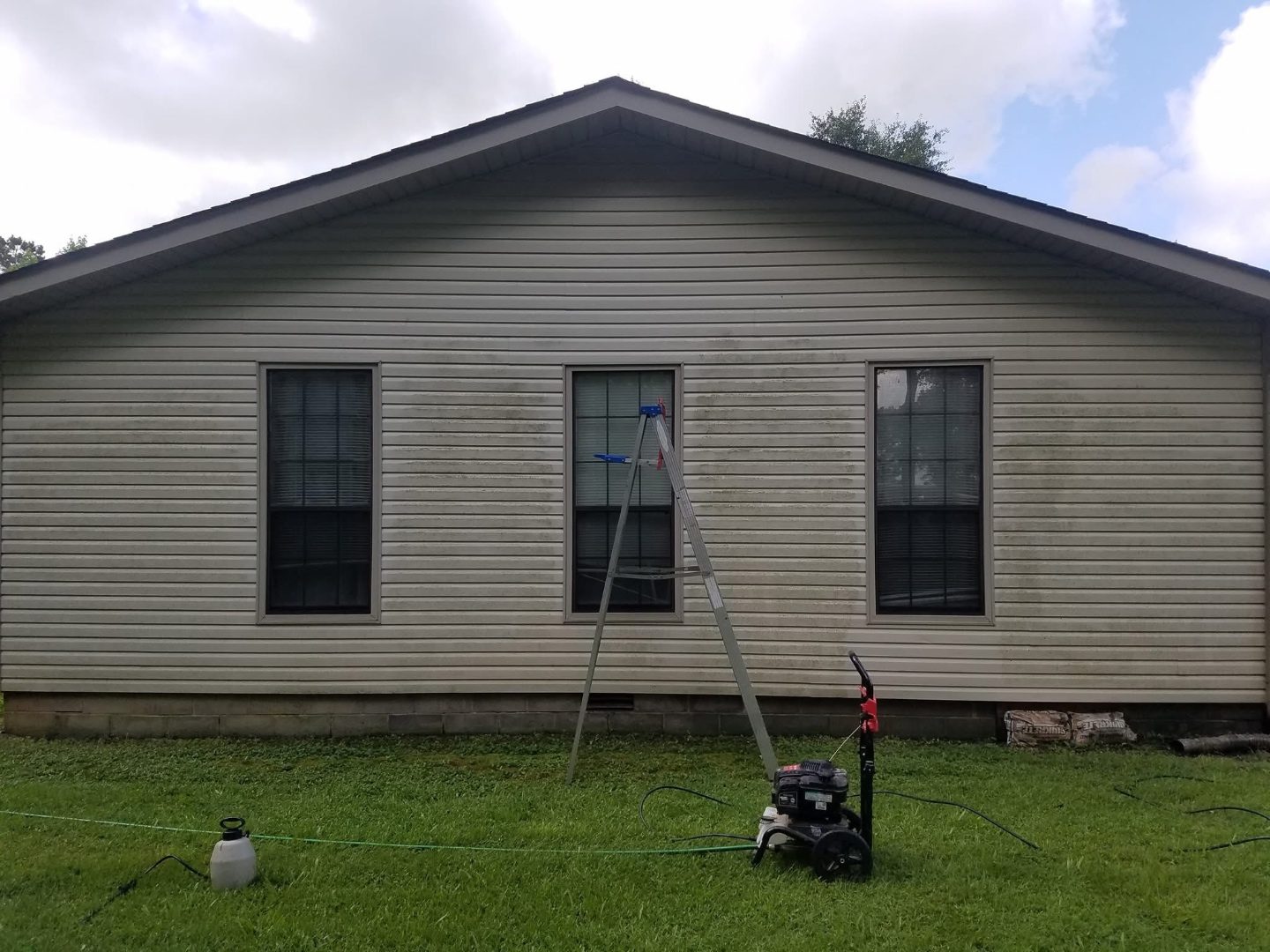 Pressure washing driveway concrete with rotary surface cleaner